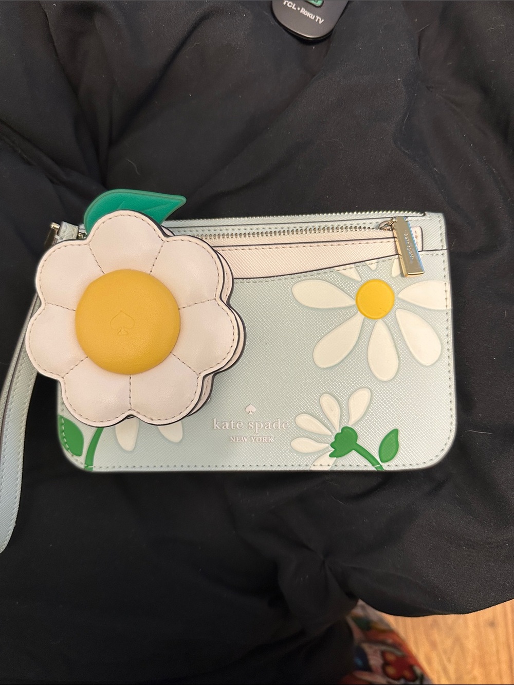 kate spade pastel blue daisy wristlet with yellow floral charm